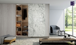 Fitted sliding door wardrobe with frameless top hung doors in combination of White Levanto Marble and Fabric ash .jpg