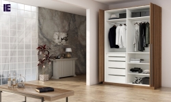 Fitted wardrobe with pocket door system in walnut wood finish_1 (1).jpg