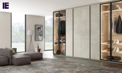 Fitted wardrobe in combination of linear glass and linear wood in white chromix finish.jpg